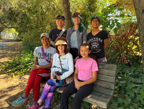 Women veterans and supporters gather during a community walk